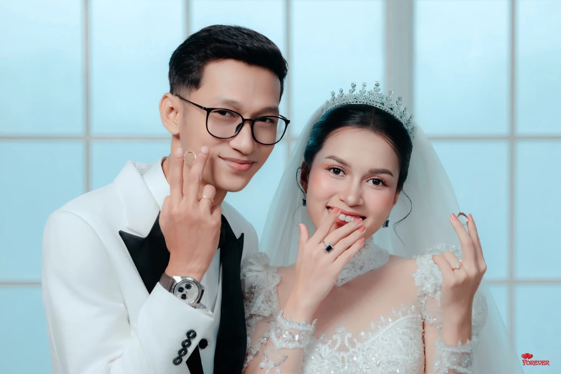 Aung and Hnin making finger hearts