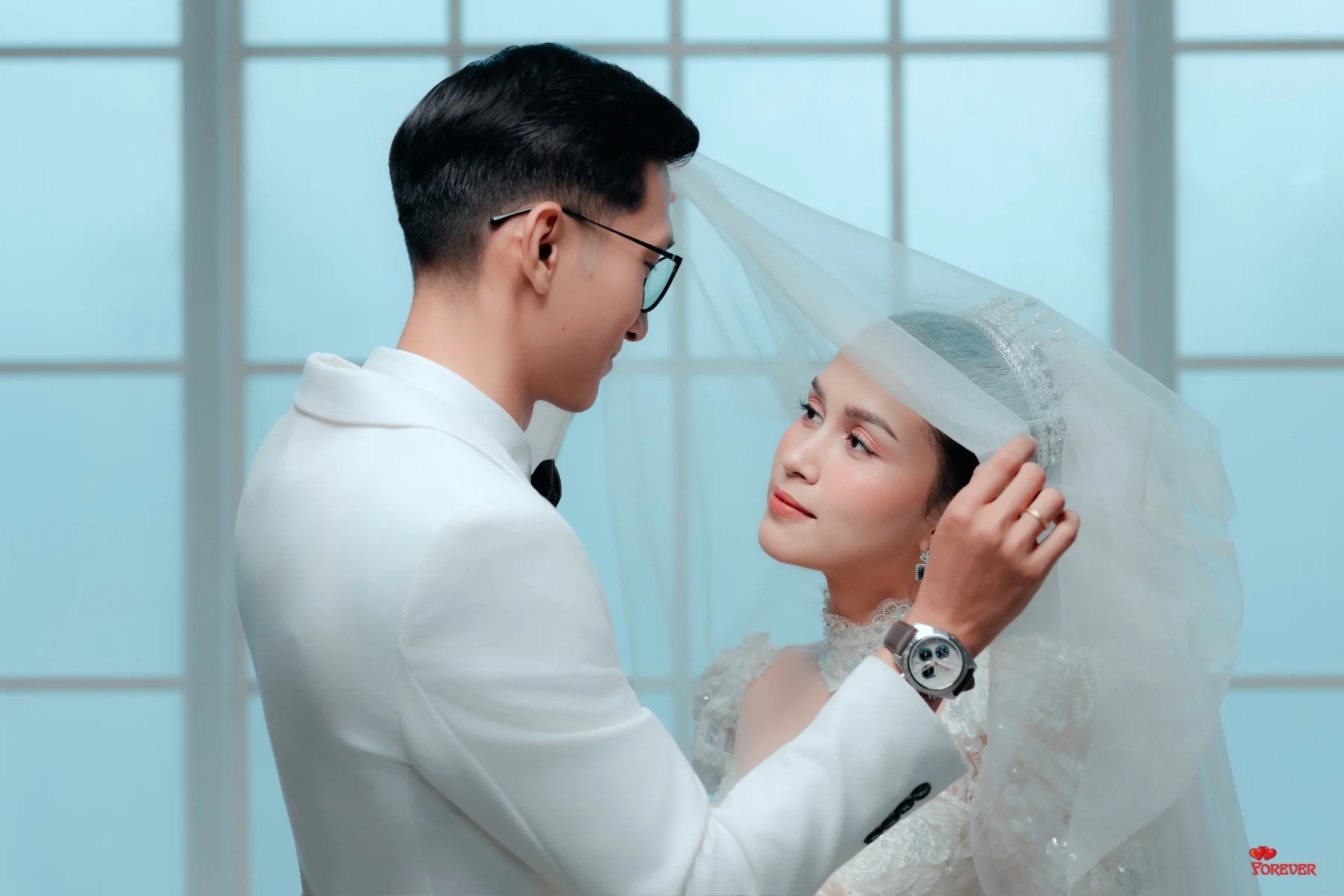 Aung lifting Hnin's veil