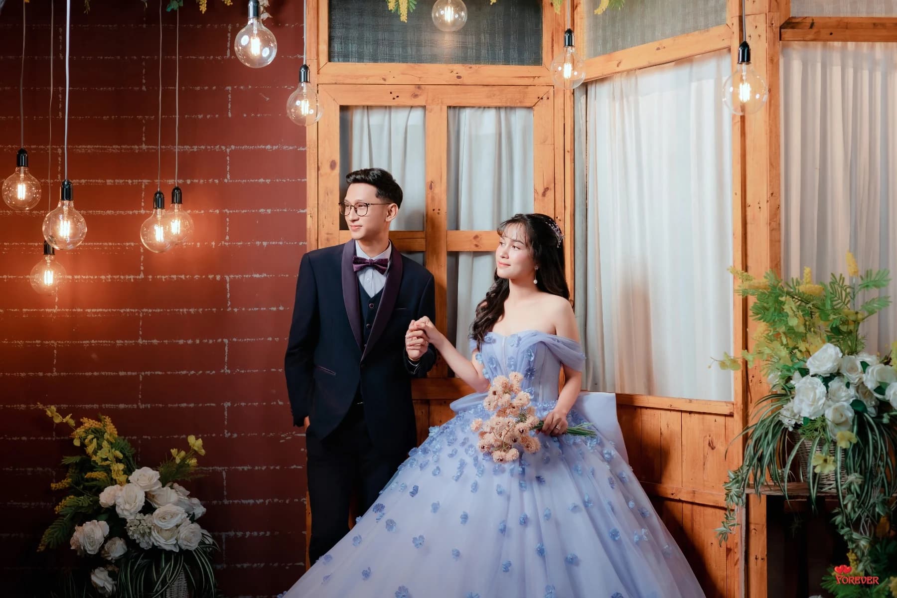 Aung and Hnin in a candlelit brick room